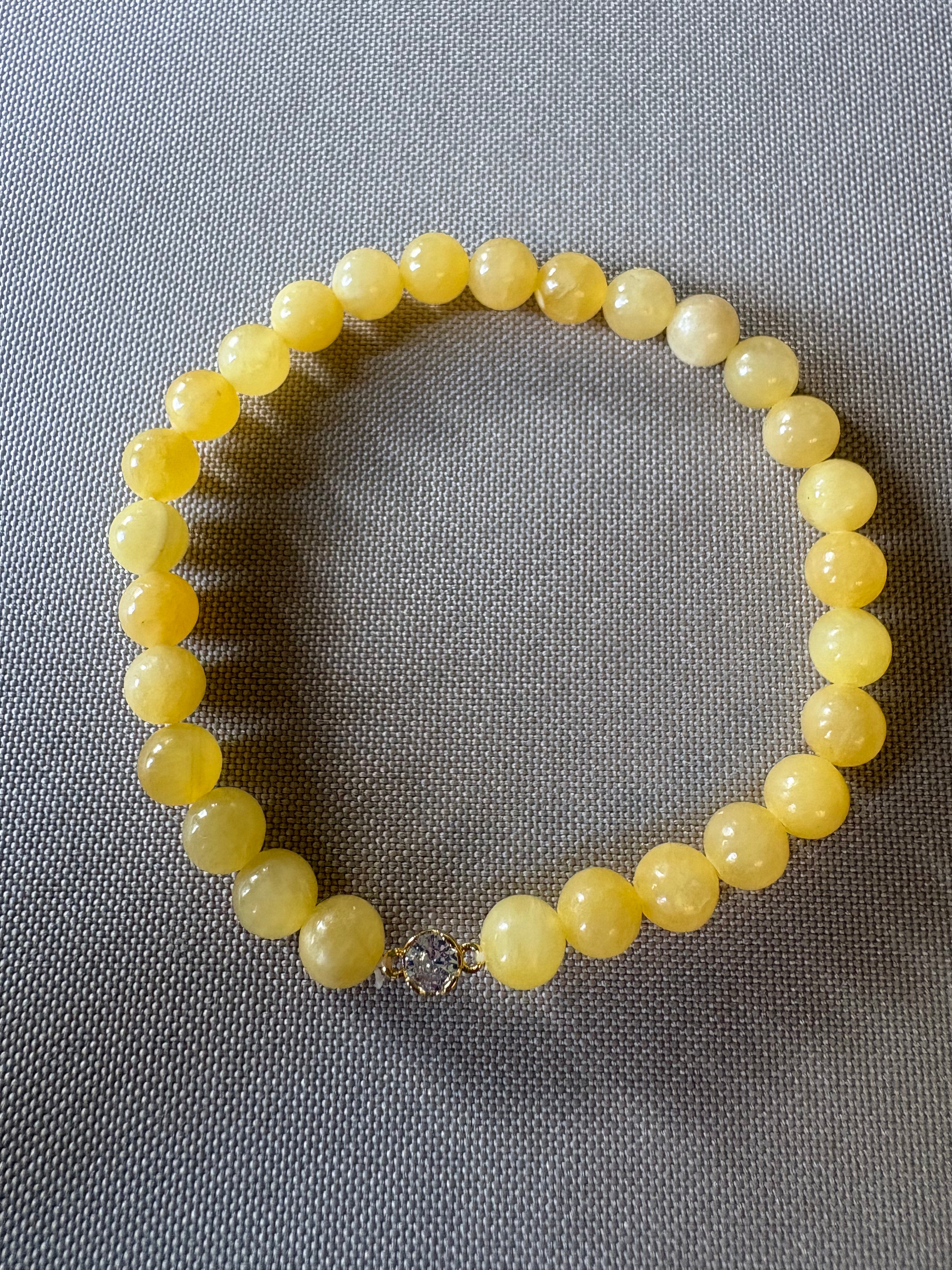 Yellow jade with rhinestone